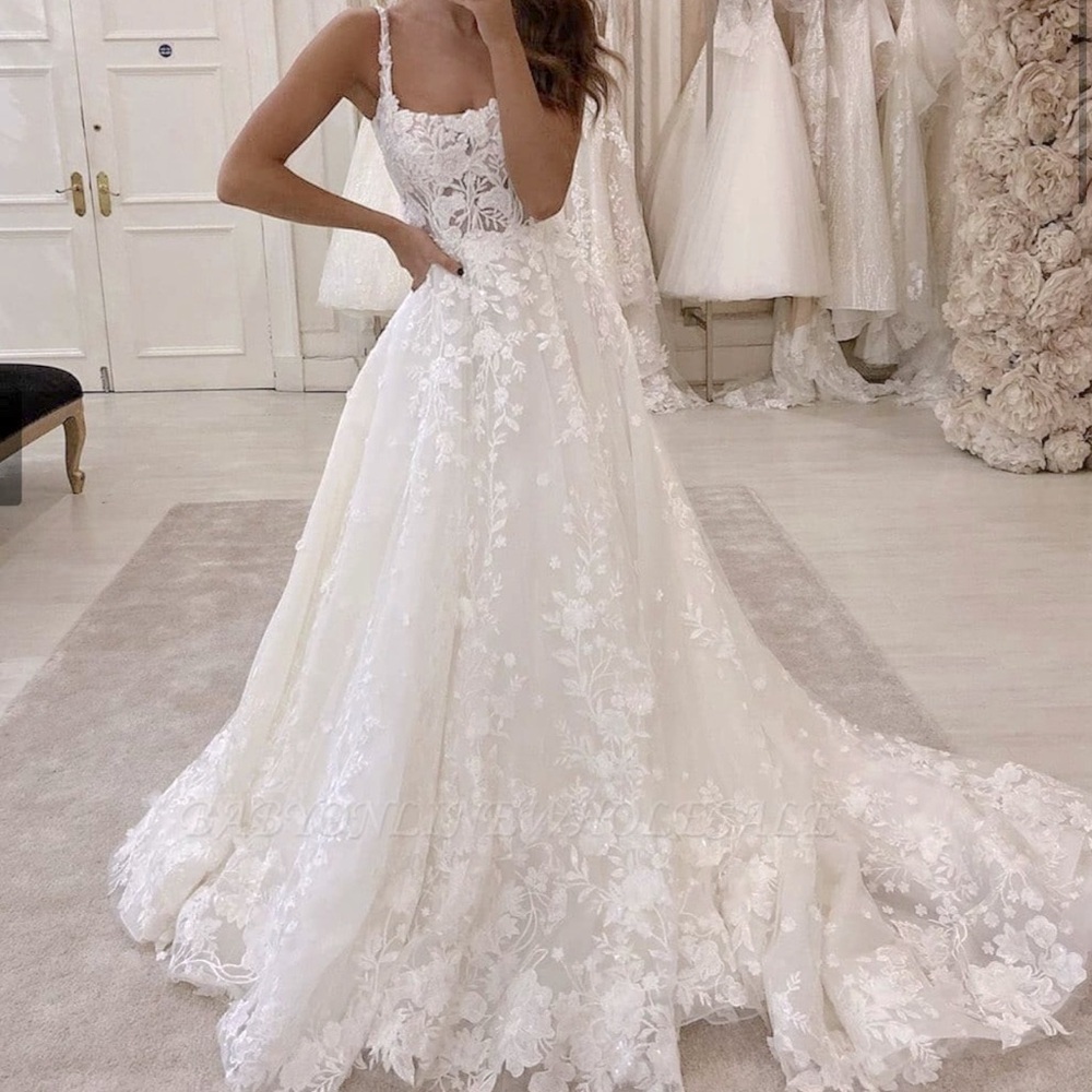 Martina Liana: ivory beaded floral A-line wedding dress with tulle train